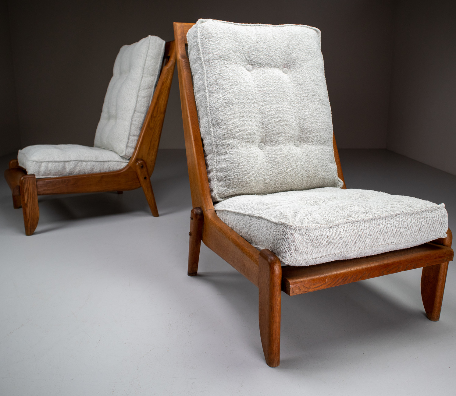 Pair Oak Lounge chairs by Guillerme & Chambron with newly upholstered cushions in boucle fabric , France, circa 1950 Mid-20th century