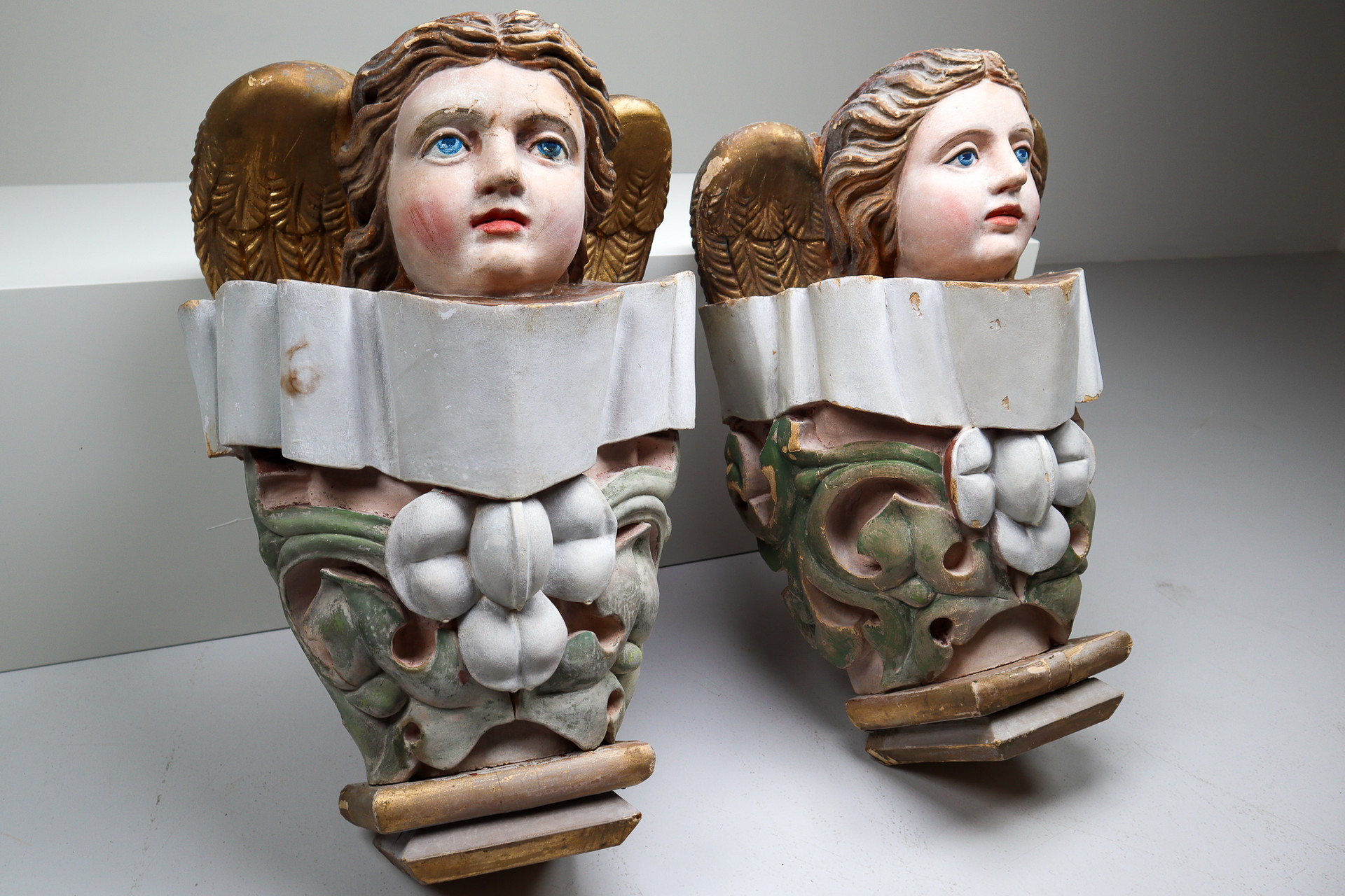 Pair of French antique wooden pedestal with carved cherub angels. Early-19th century
