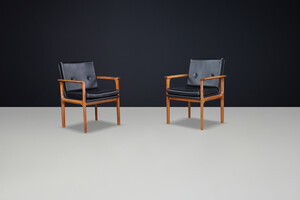Scandinavian modern Armchairs in wood and black leather 1960s Mid-20th century