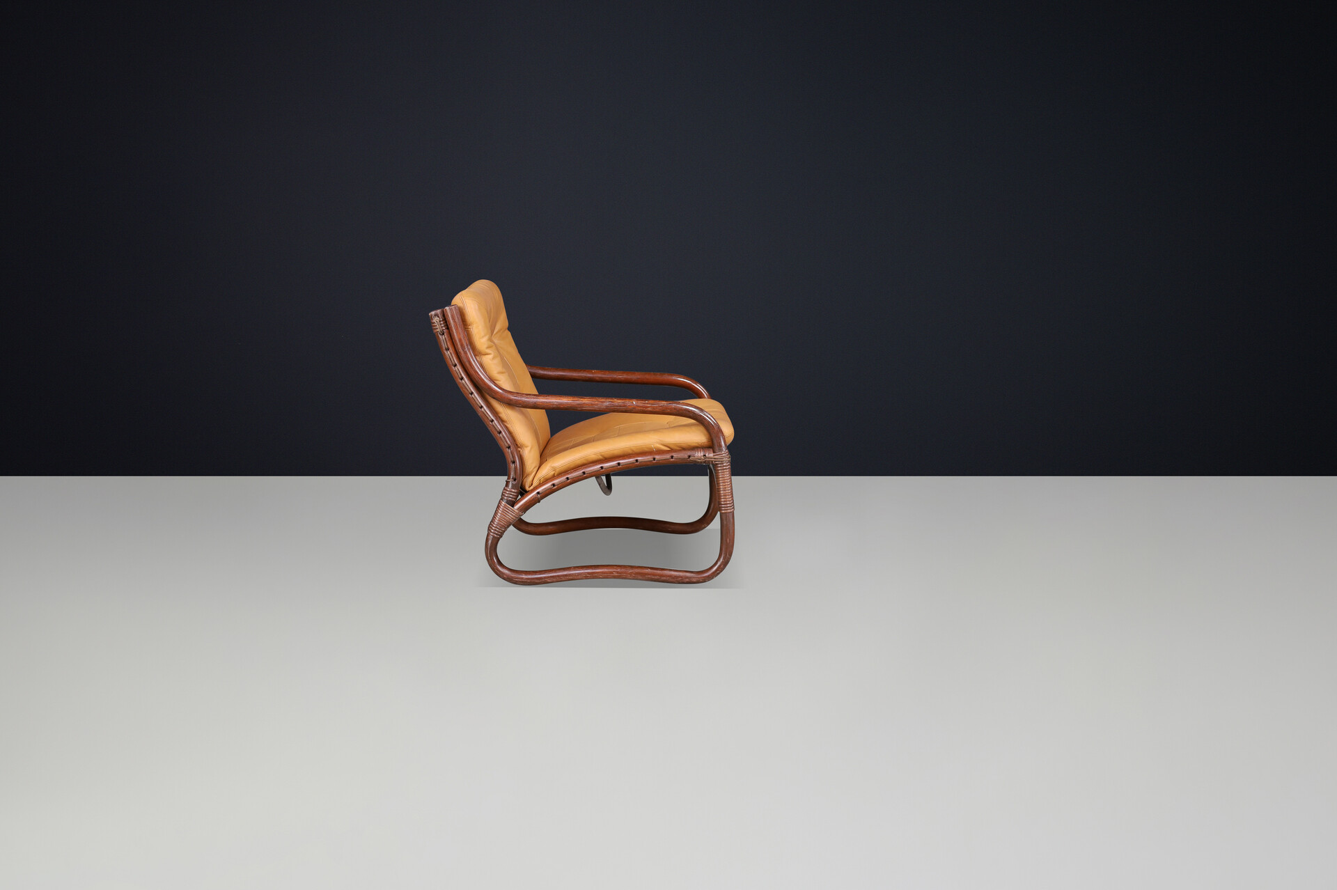 Scandinavian modern “Ecco” Easy Chair by Slettvoll in Cognac Leather and Patinated Rattan, Norway, 1970s Late-20th century