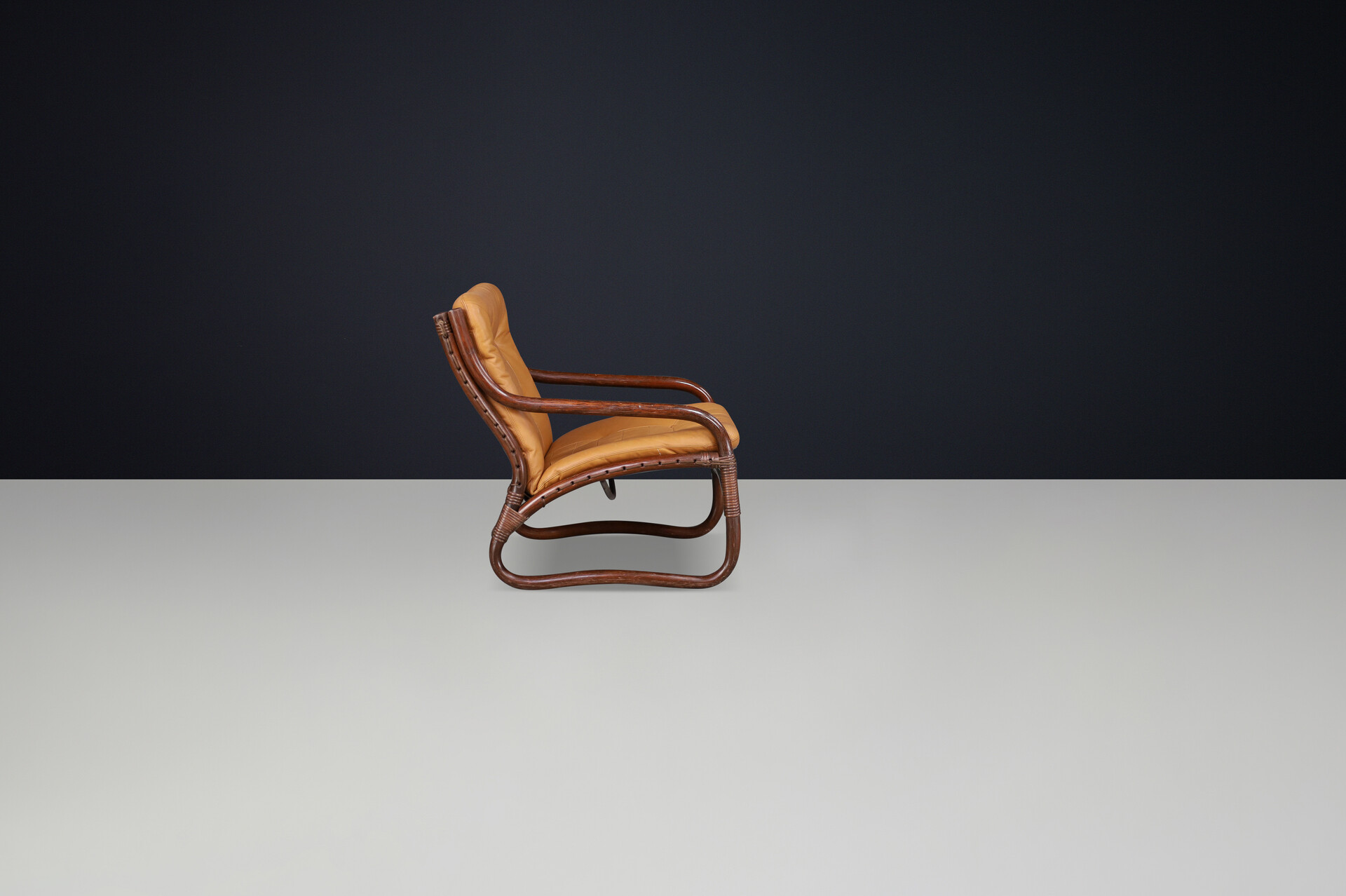 Scandinavian modern “Ecco” Easy Chair by Slettvoll in Cognac Leather and Patinated Rattan, Norway, 1970s Late-20th century