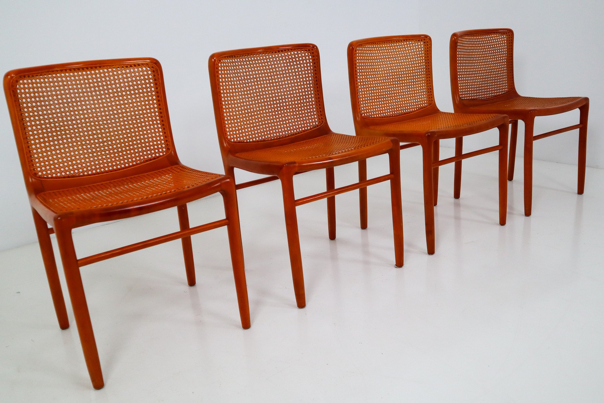 Walnut Dinning chairs with cane seats and backs. Italy 1970s Mid-20th century
