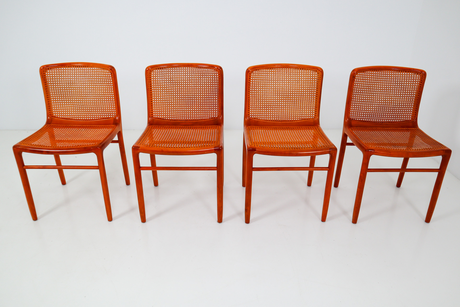 Walnut Dinning chairs with cane seats and backs. Italy 1970s Mid-20th century